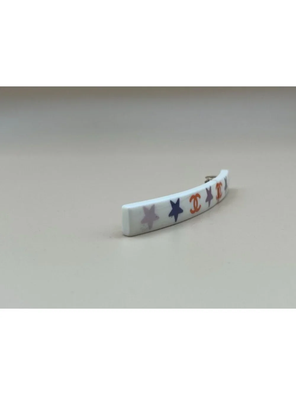 Authentic vintage Chanel bar barrette in cream-white resin, printed with two red